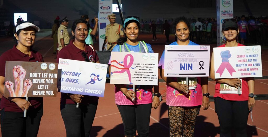 FILE PIC WOMEN WITH PLACARDS AND CANCER AWARNESS MESSAGE