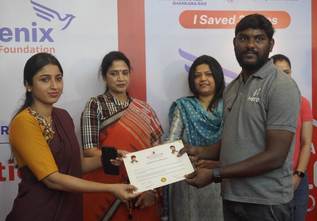 N BHAVANI SRI IAS DEPUTY DEVELOPMENT COMMISSIONER SEZ SEEN PRESENTING CERTIFICATES TO BLOOD DONORS