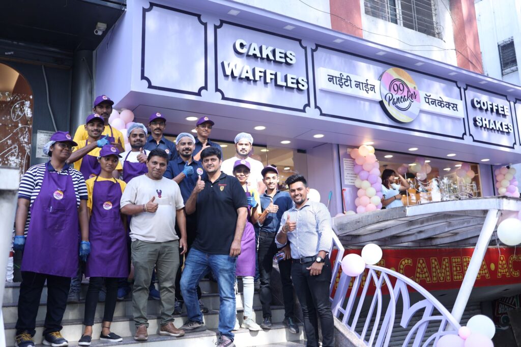 Vikesh Shah, Founder, 99 Pancakes (in white) along with his team at 99 Pancakes outlet