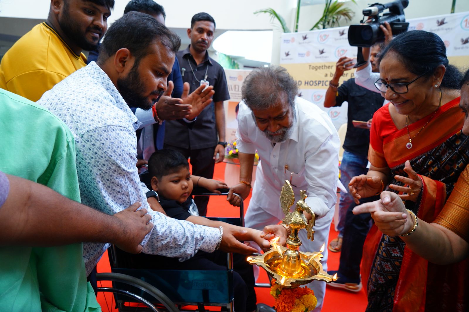 Shri C. DAMODARA RAJANARASIMHA, seen lighting the lamp to mark the inauguration of the celebrations